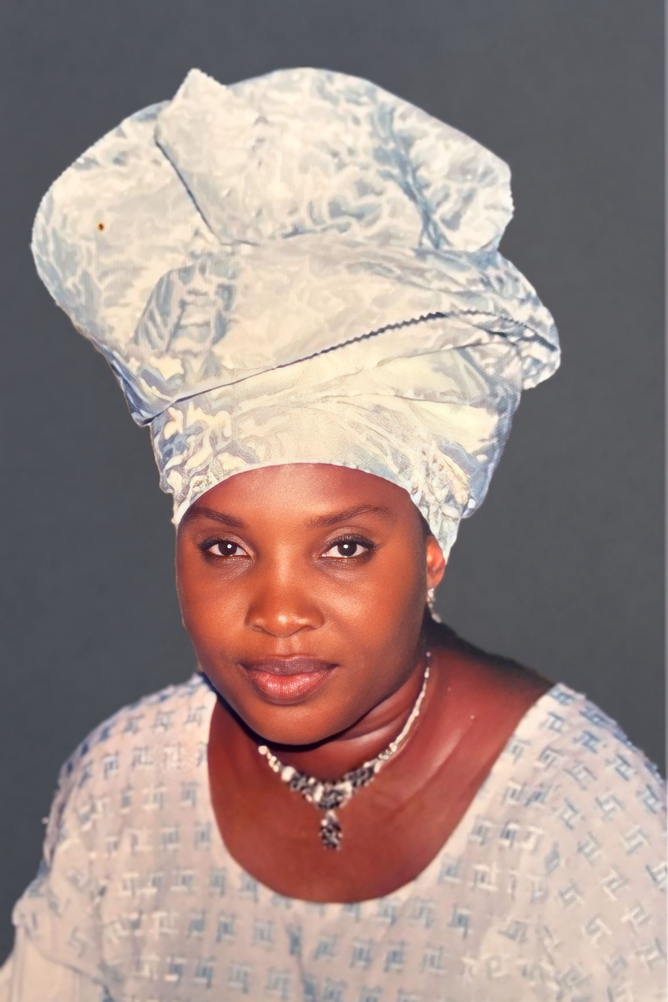 A woman wearing a gele